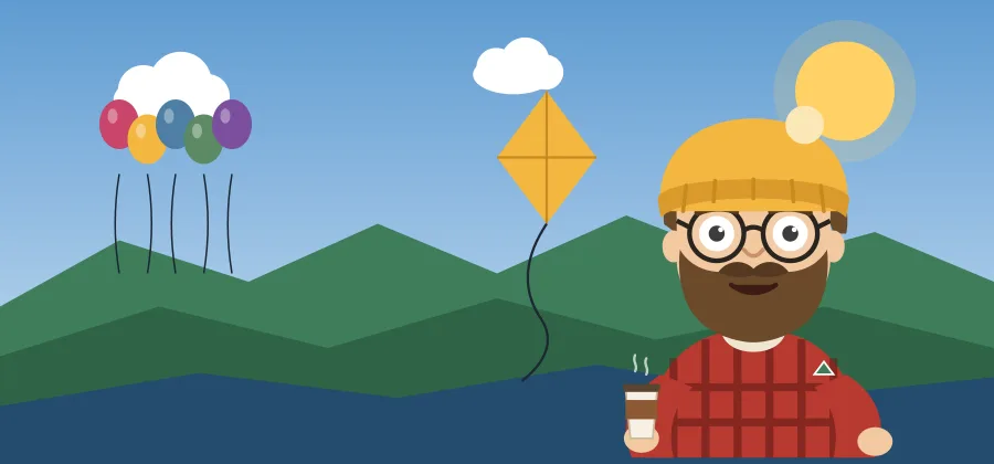 Balloons and a kite over green mountains